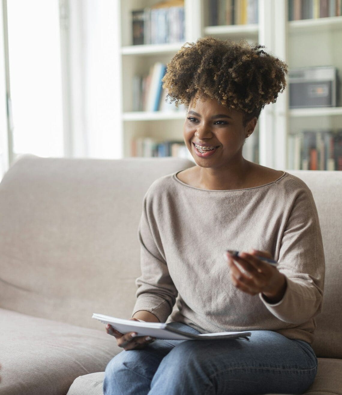 Smiling friendly black woman psychologist having conversation with patient
